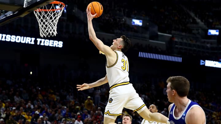 Mar 20, 2025; Wichita, KS, USA; Missouri Tigers guard Caleb Grill (31) shoots against Drake Bulldogs guard Mitch Mascari (22) in the first half of a first round men’s NCAA Tournament game at Intrust Bank Arena. Mandatory Credit: Nick Tre. Smith-Imagn Images Mar 20, 2025; Wichita, KS, USA; Missouri Tigers guard Caleb Grill (31) shoots against Drake Bulldogs guard Mitch Mascari (22) in the first half of a first round men’s NCAA Tournament game at Intrust Bank Arena. Mandatory Credit: Nick Tre. Smith-Imagn Images