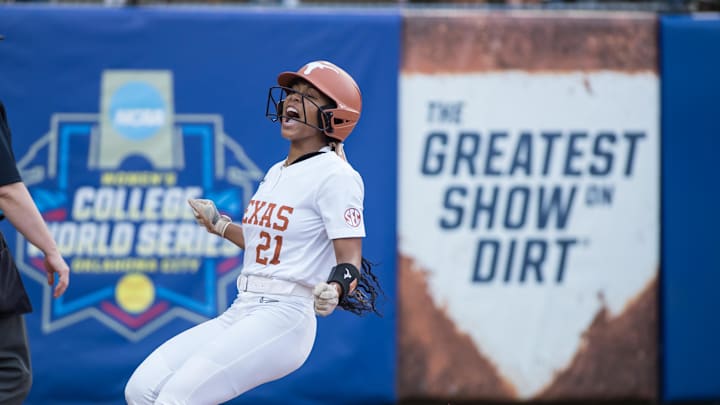 Jun 6, 2025; Oklahoma City, OK, USA;  Texas Longhorns outfielder Kayden Henry (21) yells after scoring a run in the first inning against the Texas Tech Red Raiders during game three of the NCAA Softball Women's College World Series finals at Devon Park. Mandatory Credit: Brett Rojo-Imagn Images