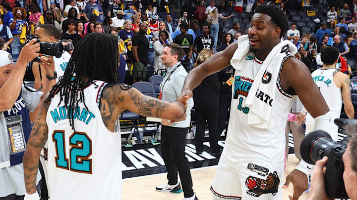 Apr 18, 2025; Memphis, Tennessee, USA; Memphis Grizzlies guard Ja Morant (12) and forward Jaren Jackson Jr. (13) react after defeating the Dallas Mavericks at FedExForum. Mandatory Credit: Petre Thomas-Imagn Images Apr 18, 2025; Memphis, Tennessee, USA; Memphis Grizzlies guard Ja Morant (12) and forward Jaren Jackson Jr. (13) react after defeating the Dallas Mavericks at FedExForum. Mandatory Credit: Petre Thomas-Imagn Images