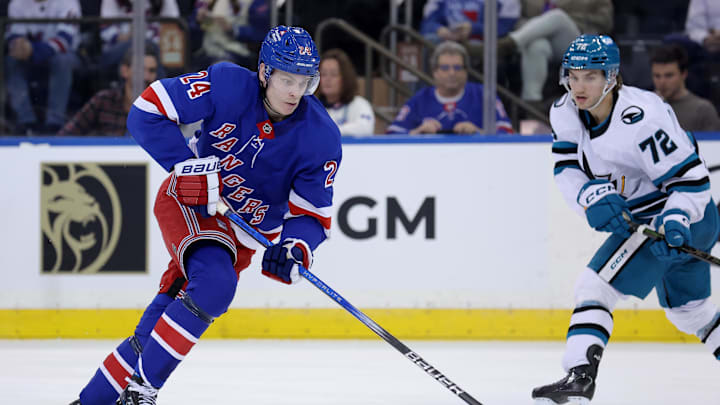 Nov 14, 2024; New York, New York, USA; New York Rangers right wing Kaapo Kakko (24) skates with the puck against San Jose Sharks left wing William Eklund (72) during the third period at Madison Square Garden. Mandatory Credit: Brad Penner-Imagn Images