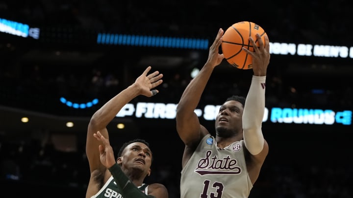 March 21, 2024, Charlotte, NC, USA; Mississippi State Bulldogs guard Josh Hubbard (13) shoots over Michigan State Spartans guard Tyson Walker (2) in the first round of the 2024 NCAA Tournament at the Spectrum Center. Mandatory Credit: Bob Donnan-USA TODAY Sports