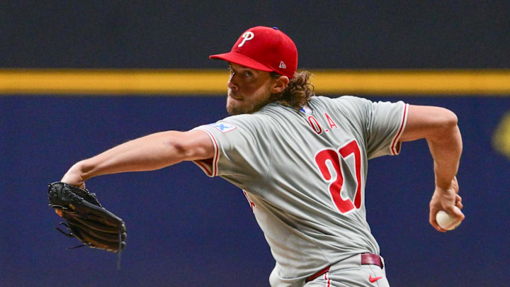 Sep 18, 2024; Milwaukee, Wisconsin, USA; Philadelphia Phillies starting pitcher Aaron Nola (27) pitches in the first inning against the Milwaukee Brewers at American Family Field.