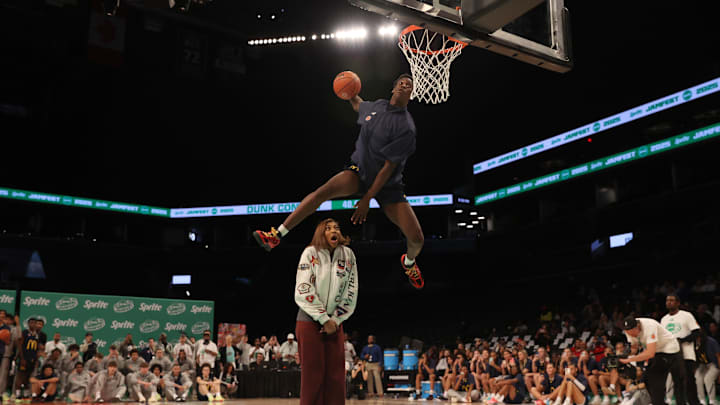 Mar 31, 2025; Brooklyn, New York, USA; McDonald’s All American West forward AJ Dybantsa (3) dunks the ball over  Chicago Sky forward Angel Reese during the Sprite Jam Fest