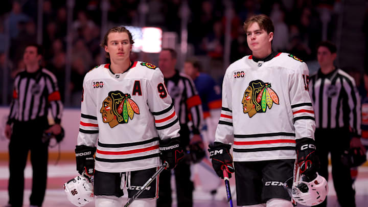 Mar 24, 2026; Elmont, New York, USA; Chicago Blackhawks centers Connor Bedard (98) and Anton Frondell (15) stand for the US national anthem before a game against the New York Islanders at UBS Arena. Mandatory Credit: Brad Penner-Imagn Images