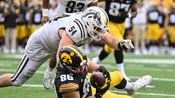 Sep 16, 2023; Iowa City, Iowa, USA; Iowa Hawkeyes tight end Steven Stilianos (86) and Western Michigan Broncos defensive lineman Mason Nelson (54) in action during the game at Kinnick Stadium. Mandatory Credit: Jeffrey Becker-Imagn Images