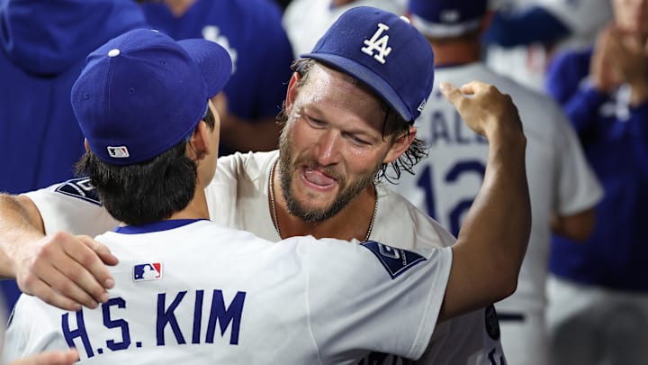 Sep 19, 2025; Los Angeles, California, USA; Los Angeles Dodgers pitcher Clayton Kershaw (22) is greeted by second baseman Hyeseong Kim (6) after being relieved during the fifth inning against the San Francisco Giants at Dodger Stadium. Sep 19, 2025; Los Angeles, California, USA; Los Angeles Dodgers pitcher Clayton Kershaw (22) is greeted by second baseman Hyeseong Kim (6) after being relieved during the fifth inning against the San Francisco Giants at Dodger Stadium.