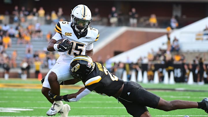 Appalachian State Mountaineers wide receiver Jaden Barnes (15) is tackled by Southern Miss Golden Eagles safety Corey Myrick (22) during the first quarter at M.M. Roberts Stadium in Hattiesburg, Mississippi, on September 13, 2025.