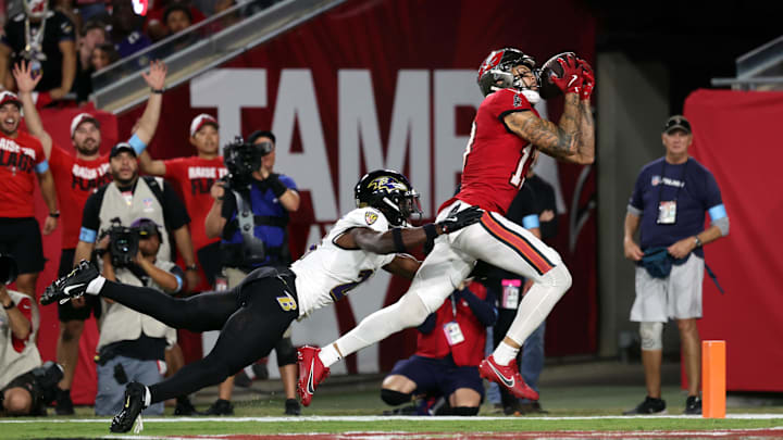 Oct 21, 2024; Tampa, Florida, USA; Baltimore Ravens cornerback Brandon Stephens (21) defends Tampa Bay Buccaneers wide receiver Mike Evans (13) during the first half at Raymond James Stadium. Mandatory Credit: Kim Klement Neitzel-Imagn Images Oct 21, 2024; Tampa, Florida, USA; Baltimore Ravens cornerback Brandon Stephens (21) defends Tampa Bay Buccaneers wide receiver Mike Evans (13) during the first half at Raymond James Stadium. Mandatory Credit: Kim Klement Neitzel-Imagn Images