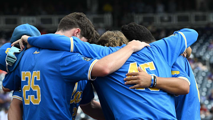 Jun 17, 2025; Omaha, Neb, USA; UCLA Bruins players huddle before the restart of the game against the LSU Tigers at Charles Schwab Field. Mandatory Credit: Steven Branscombe-Imagn Images Jun 17, 2025; Omaha, Neb, USA; UCLA Bruins players huddle before the restart of the game against the LSU Tigers at Charles Schwab Field. Mandatory Credit: Steven Branscombe-Imagn Images