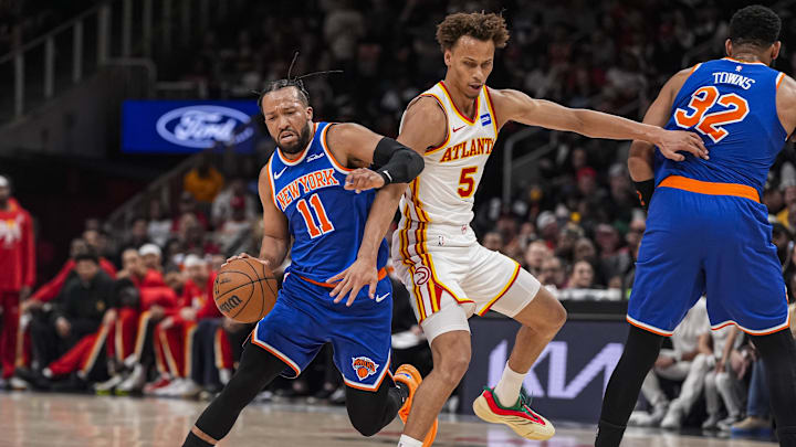 Apr 25, 2026; Atlanta, Georgia, USA; New York Knicks guard Jalen Brunson (11) tries to dribble past Atlanta Hawks guard Dyson Daniels (5) during the first half at State Farm Arena. Mandatory Credit: Dale Zanine-Imagn Images