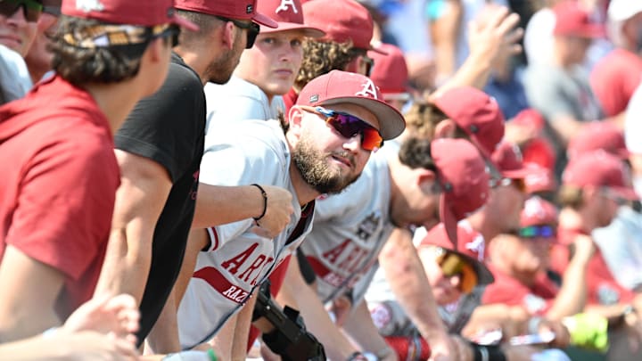 The Arkansas Razorbacks bench watches the scoreboard against the Murray State Racers during the ninth inning at Charles Schwab Field. The Arkansas Razorbacks bench watches the scoreboard against the Murray State Racers during the ninth inning at Charles Schwab Field.