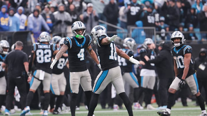 Nov 30, 2025; Charlotte, North Carolina, USA; Carolina Panthers wide receiver Tetairoa McMillan (4) celebrates with Carolina Panthers wide receiver Jalen Coker (18) after a play during the fourth quarter against the Los Angeles Rams at Bank of America Stadium. Mandatory Credit: Scott Kinser-Imagn Images Nov 30, 2025; Charlotte, North Carolina, USA; Carolina Panthers wide receiver Tetairoa McMillan (4) celebrates with Carolina Panthers wide receiver Jalen Coker (18) after a play during the fourth quarter against the Los Angeles Rams at Bank of America Stadium. Mandatory Credit: Scott Kinser-Imagn Images