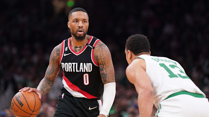 Mar 8, 2023; Boston, Massachusetts, USA; Portland Trail Blazers guard Damian Lillard (0) dribbles the ball against Boston Celtics forward Jayson Tatum (0) in the second quarter at TD Garden. Mandatory Credit: David Butler II-Imagn Images