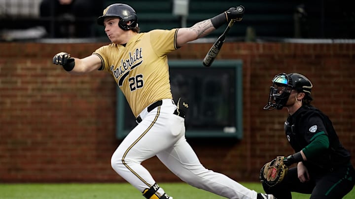 Vanderbilt center fielder Braden Holcomb (26) watches his single against Eastern Michigan during the first inning at Hawkins Field in Nashville, Tenn., Wednesday, Feb. 18, 2026. Vanderbilt center fielder Braden Holcomb (26) watches his single against Eastern Michigan during the first inning at Hawkins Field in Nashville, Tenn., Wednesday, Feb. 18, 2026.