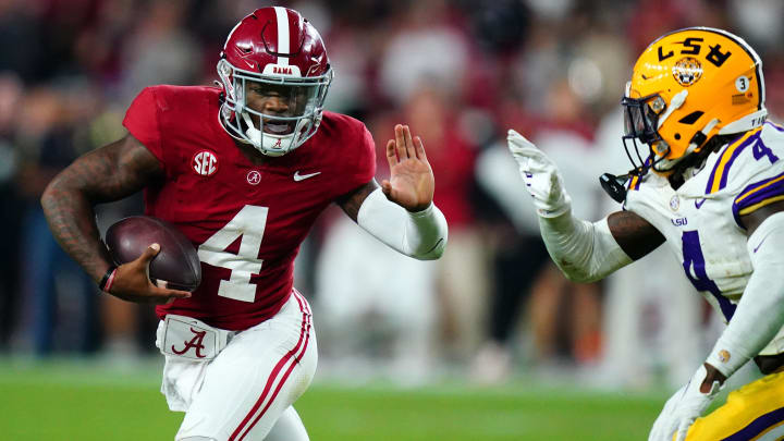 Nov 4, 2023; Tuscaloosa, Alabama, USA; Alabama Crimson Tide quarterback Jalen Milroe (4) scrambles up the field against the LSU Tigers during the second half at Bryant-Denny Stadium. Alabama Crimson Tide defeated the LSU Tigers 42-28. Mandatory Credit: John David Mercer-USA TODAY Sports
