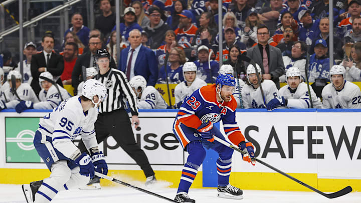 Feb 1, 2025; Edmonton, Alberta, CAN; Edmonton Oilers forward Leon Draisaitl (29) looks to make a pass in front of Toronto Maple Leafs defensemen Oliver Elman-Larsson (95) during the first period at Rogers Place. Mandatory Credit: Perry Nelson-Imagn Images