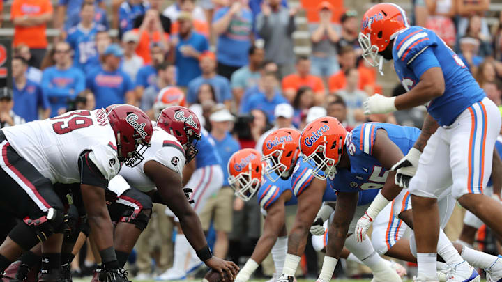 Nov 10, 2018; Gainesville, FL, USA; South Carolina Gamecocks offensive line and Florida Gators defensive line line up at the line of scrimmage during the first quarter at Ben Hill Griffin Stadium. Mandatory Credit: Kim Klement-Imagn Images Nov 10, 2018; Gainesville, FL, USA; South Carolina Gamecocks offensive line and Florida Gators defensive line line up at the line of scrimmage during the first quarter at Ben Hill Griffin Stadium. Mandatory Credit: Kim Klement-Imagn Images