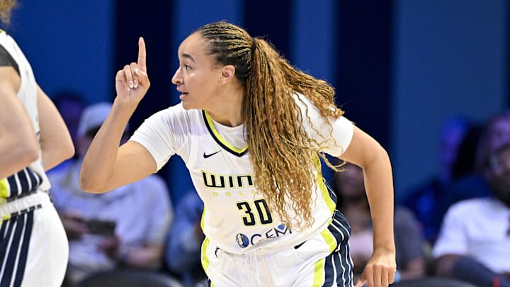 Sep 11, 2025; Arlington, Texas, USA; Dallas Wings guard Haley Jones (30) celebrates making a basket against the Phoenix Mercury during the second half at College Park Center. Mandatory Credit: Jerome Miron-Imagn Images
