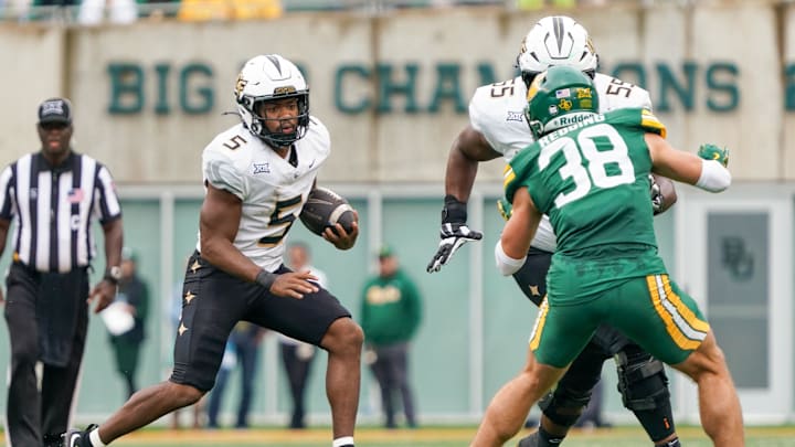 Nov 1, 2025; Waco, Texas, USA; UCF Knights running back Jaden Nixon (5) carries the ball against the Baylor Bears during the second half at McLane Stadium. Mandatory Credit: Raymond Car lin III-Imagn Images