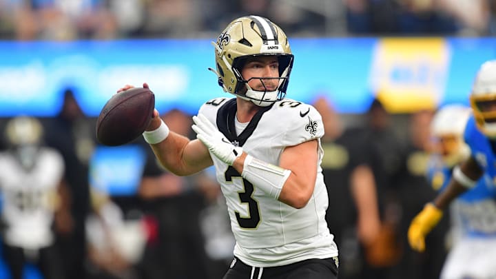Oct 27, 2024; Inglewood, California, USA; New Orleans Saints quarterback Jake Haener (3) throws against the Los Angeles Chargers during the second half at SoFi Stadium. Mandatory Credit: Gary A. Vasquez-Imagn Images