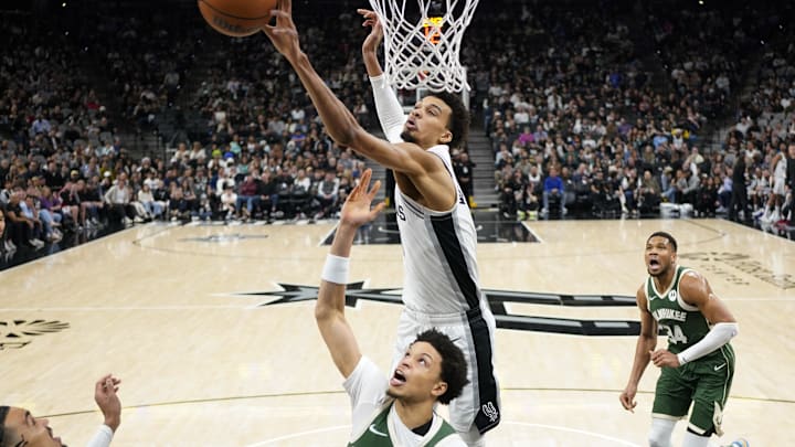 Jan 31, 2025; San Antonio, Texas, USA; San Antonio Spurs center Victor Wembanyama (1) blocks the shot attempt by Milwaukee Bucks guard Ryan Rollins (13) during the first half at Frost Bank Center. Mandatory Credit: Scott Wachter-Imagn Images Jan 31, 2025; San Antonio, Texas, USA; San Antonio Spurs center Victor Wembanyama (1) blocks the shot attempt by Milwaukee Bucks guard Ryan Rollins (13) during the first half at Frost Bank Center. Mandatory Credit: Scott Wachter-Imagn Images