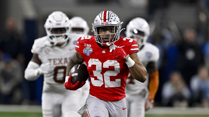 Jan 10, 2025; Arlington, TX, USA;  Ohio State Buckeyes running back TreVeyon Henderson (32) scores a touchdown on a pass from quarterback Will Howard (not pictured) during the second quarter at AT&T Stadium. Mandatory Credit: Jerome Miron-Imagn Images