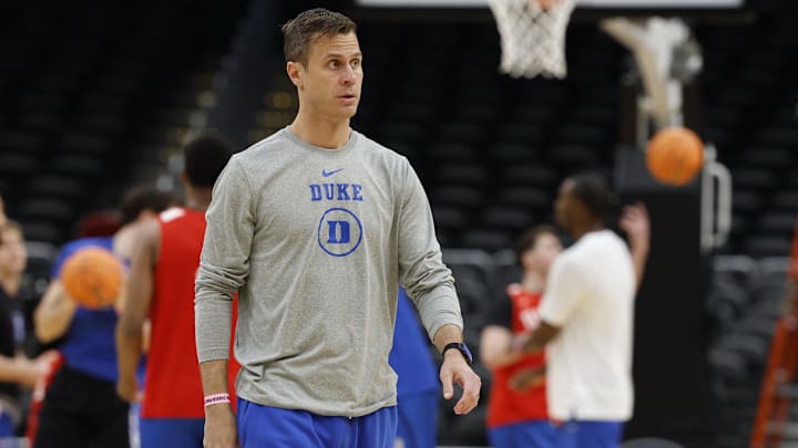 Mar 26, 2026; Washington, DC, USA; Duke Blue Devils head coach Jon Scheyer stands on the court during a practice session ahead of the east regional of the men's 2026 NCAA Tournament at Capital One Arena. Mandatory Credit: Geoff Burke-Imagn Images Mar 26, 2026; Washington, DC, USA; Duke Blue Devils head coach Jon Scheyer stands on the court during a practice session ahead of the east regional of the men's 2026 NCAA Tournament at Capital One Arena. Mandatory Credit: Geoff Burke-Imagn Images