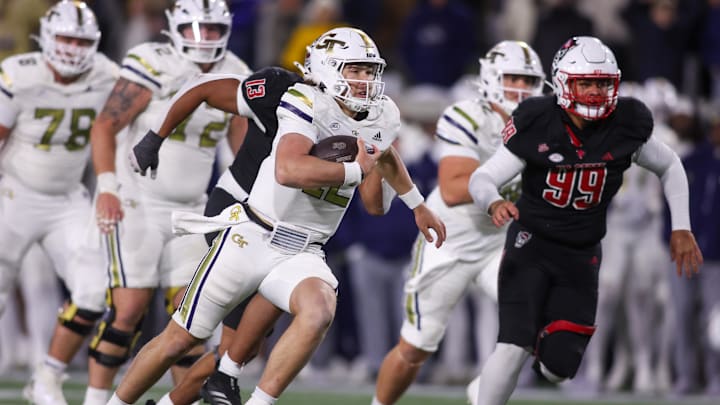 Nov 21, 2024; Atlanta, Georgia, USA; Georgia Tech Yellow Jackets quarterback Aaron Philo (12) runs the ball for a touchdown against the North Carolina State Wolfpack in the fourth quarter at Bobby Dodd Stadium at Hyundai Field. Mandatory Credit: Brett Davis-Imagn Images