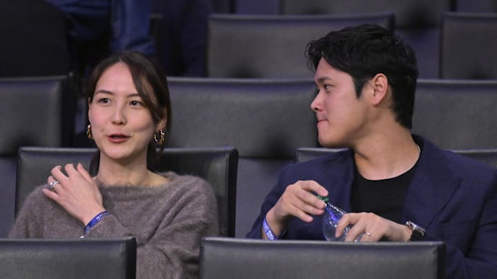Los Angeles Dodgers Shohei Ohtani (17) and his wife Mamiko Tanaka attends the game between the Los Angeles Lakers and the Portland Trail Blazers at Crypto.com Arena in 2024.