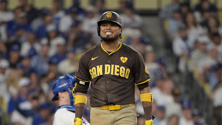 Oct 11, 2024; Los Angeles, California, USA; San Diego Padres first baseman Luis Arraez (4) reacts at bat in the sixth inning against the Los Angeles Dodgers during game five of the NLDS for the 2024 MLB Playoffs at Dodger Stadium. Mandatory Credit: Jayne Kamin-Oncea-Imagn Images