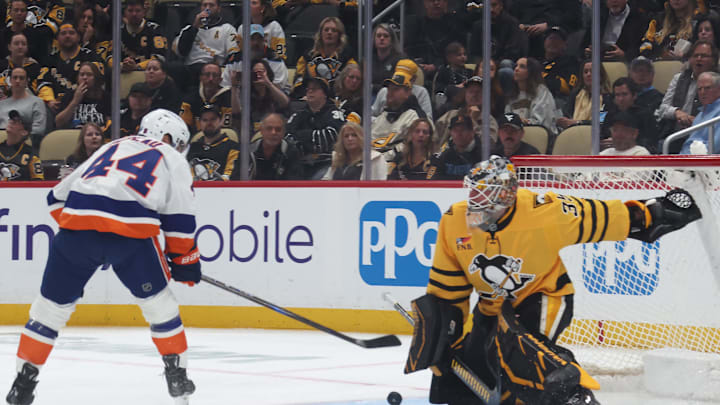 Oct 9, 2025; Pittsburgh, Pennsylvania, USA;  Pittsburgh Penguins goaltender Tristan Jarry (35) makes a save against New York Islanders center Jean-Gabriel Pageau (44) during the second period at PPG Paints Arena. Mandatory Credit: Charles LeClaire-Imagn Images Oct 9, 2025; Pittsburgh, Pennsylvania, USA;  Pittsburgh Penguins goaltender Tristan Jarry (35) makes a save against New York Islanders center Jean-Gabriel Pageau (44) during the second period at PPG Paints Arena. Mandatory Credit: Charles LeClaire-Imagn Images