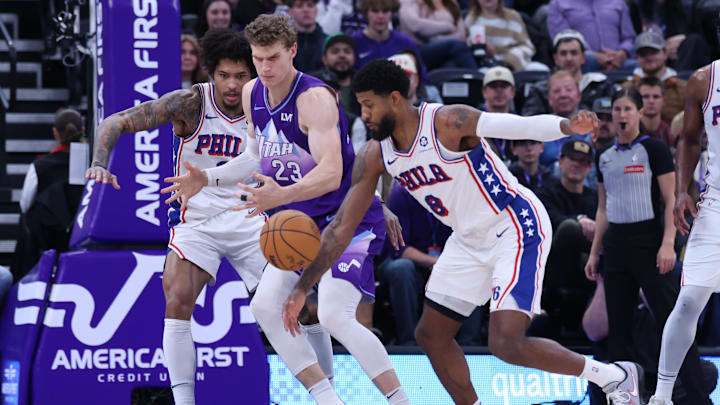 Dec 28, 2024; Salt Lake City, Utah, USA; Philadelphia 76ers forward Paul George (8) steals the ball from Utah Jazz forward Lauri Markkanen (23) during the second quarter at Delta Center. Mandatory Credit: Rob Gray-Imagn Images