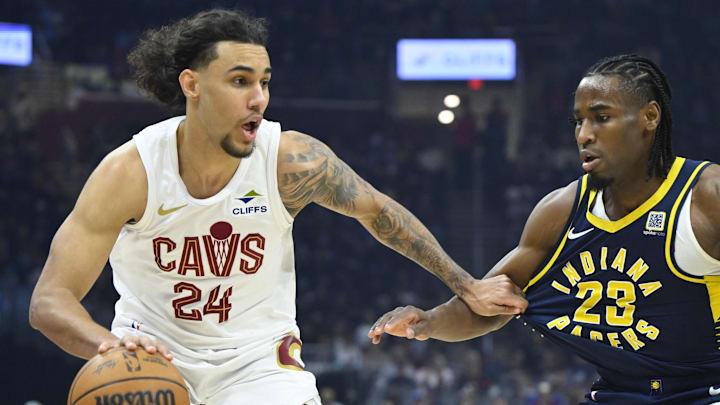 Apr 13, 2025; Cleveland, Ohio, USA; Cleveland Cavaliers forward Jaylon Tyson (24) dribbles beside Indiana Pacers forward Aaron Nesmith (23) in the first quarter at Rocket Arena. Mandatory Credit: David Richard-Imagn Images