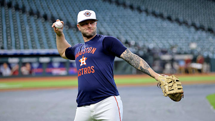 Houston Astros first baseman Christian Walker (8) warms up prior to the game against the Los Angeles Angels at Daikin Park. 
