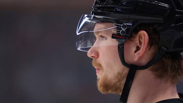 Nov 28, 2025; Buffalo, New York, USA;  Buffalo Sabres defenseman Bowen Byram (4) waits for the face-off during the third period against the New Jersey Devils at KeyBank Center. Mandatory Credit: Timothy T. Ludwig-Imagn Images