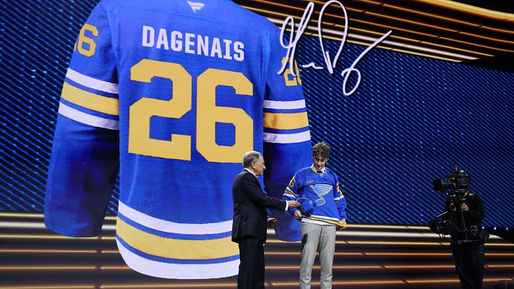 Jun 26, 2026; Buffalo, New York, USA; Maddox Dagenais reacts beside NHL commissioner Gary Bettman after being selected with the sixteenth pick in the first round of the 2026 NHL Draft by the St. Louis Blues at KeyBank Center. Mandatory Credit: Timothy T. Ludwig-Imagn Images