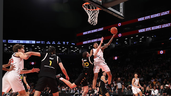 April 1, 2025; Brooklyn, N.Y., USA; McDonald's All-American West guard Meleek Thomas (5) shoots the ball against McDonald's All-American East guard Darius Adams (20) during the first half of the game at Barclays Center.