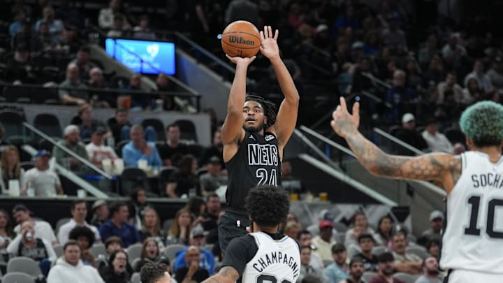 Mar 4, 2025; San Antonio, Texas, USA; Brooklyn Nets guard Cam Thomas (24) shoots over San Antonio Spurs forward Julian Champagnie (30) in the second half at Frost Bank Center. Mandatory Credit: Daniel Dunn-Imagn Images Mar 4, 2025; San Antonio, Texas, USA; Brooklyn Nets guard Cam Thomas (24) shoots over San Antonio Spurs forward Julian Champagnie (30) in the second half at Frost Bank Center. Mandatory Credit: Daniel Dunn-Imagn Images