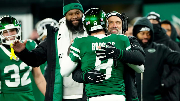 New York Jets Interim Head Coach Jeff Ulbrich congratulates New York Jets quarterback Aaron Rodgers (8)