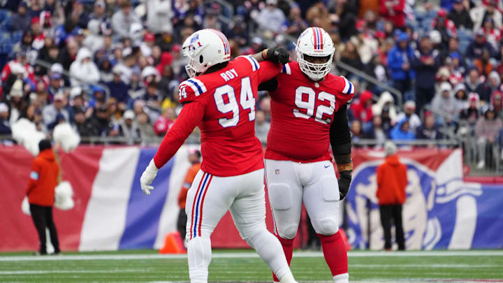 Oct 13, 2024; Foxborough, Massachusetts, USA; New England Patriots defensive tackle Jaquelin Roy (94) and New England Patriots defensive tackle Davon Godchaux (92) celebrate getting a sack against the Houston Texans during the second half at Gillette Stadium. Mandatory Credit: Gregory Fisher-Imagn Images