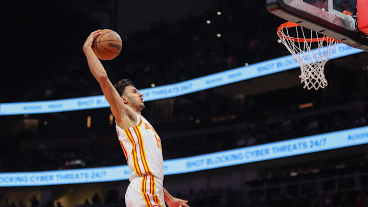 Nov 4, 2024; Atlanta, Georgia, USA; Atlanta Hawks forward Zaccharie Risacher (10) dunks against the Boston Celtics in the fourth quarter at State Farm Arena. Mandatory Credit: Brett Davis-Imagn Images