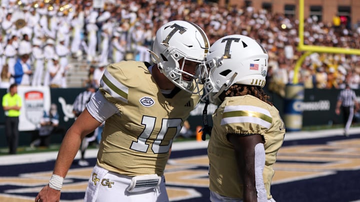 Oct 25, 2025; Atlanta, Georgia, USA; Georgia Tech Yellow Jackets quarterback Haynes King (10) celebrates with running back Jamal Haynes (1) after a touchdown against the Syracuse Orange in the third quarter at Bobby Dodd Stadium at Hyundai Field. Mandatory Credit: Brett Davis-Imagn Images
