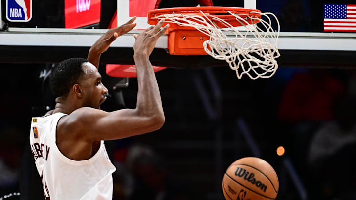 Nov 23, 2025; Cleveland, Ohio, USA; Cleveland Cavaliers center Evan Mobley (4) dunks against the Los Angeles Clippers during the second half at Rocket Arena. Mandatory Credit: Ken Blaze-Imagn Images