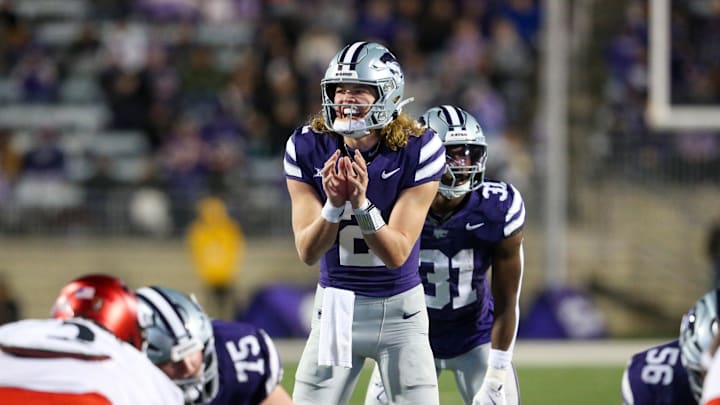 Nov 23, 2024; Manhattan, Kansas, USA; Kansas State Wildcats quarterback Avery Johnson (2) waits for the snap during the third quarter against the Cincinnati Bearcats at Bill Snyder Family Football Stadium. Mandatory Credit: Scott Sewell-Imagn Images