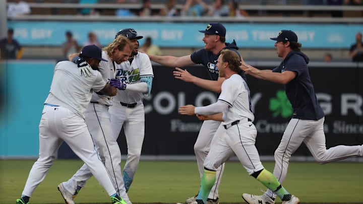 Tampa Bay Rays outfielder Travis Jankowski (20) is congratulated after he hit the game winning RBI to beat Milwaukee Brewers at George M. Steinbrenner Field on May 10.