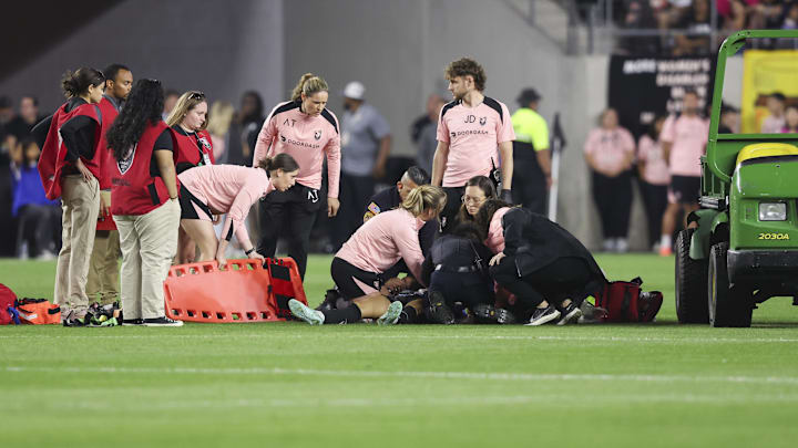 Medical personnel attend to Savy King on May 9.