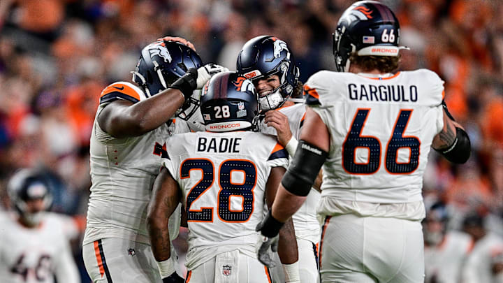 DENVER, CO - AUGUST 16: Denver Broncos quarterback Jarrett Stidham (8) and running back Tyler Badie (28) celebrate after a touchdown during a preseason game between the Arizona Cardinals and the Denver Broncos at Empower Field at Mile High on August 16, 2025 in Denver, Colorado. 