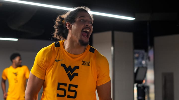Feb 5, 2026; Cincinnati, Ohio, USA;  West Virginia Mountaineers center Harlan Obioha (55) celebrates after his team’s win against the Cincinnati Bearcats at Fifth Third Arena. Mandatory Credit: Aaron Doster-Imagn Images