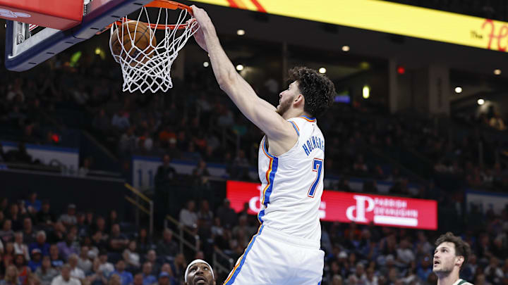 Apr 12, 2024; Oklahoma City, Oklahoma, USA; Oklahoma City Thunder forward Chet Holmgren (7) dunks against Milwaukee. 