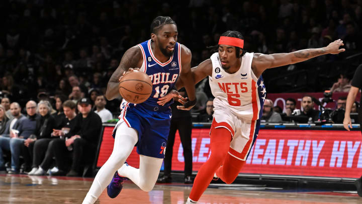 Apr 9, 2023; Brooklyn, New York, USA; Philadelphia 76ers guard Shake Milton (18) drives to the basket against Brooklyn Nets guard David Duke Jr. (6) during the first quarter at Barclays Center. Mandatory Credit: John Jones-USA TODAY Sports